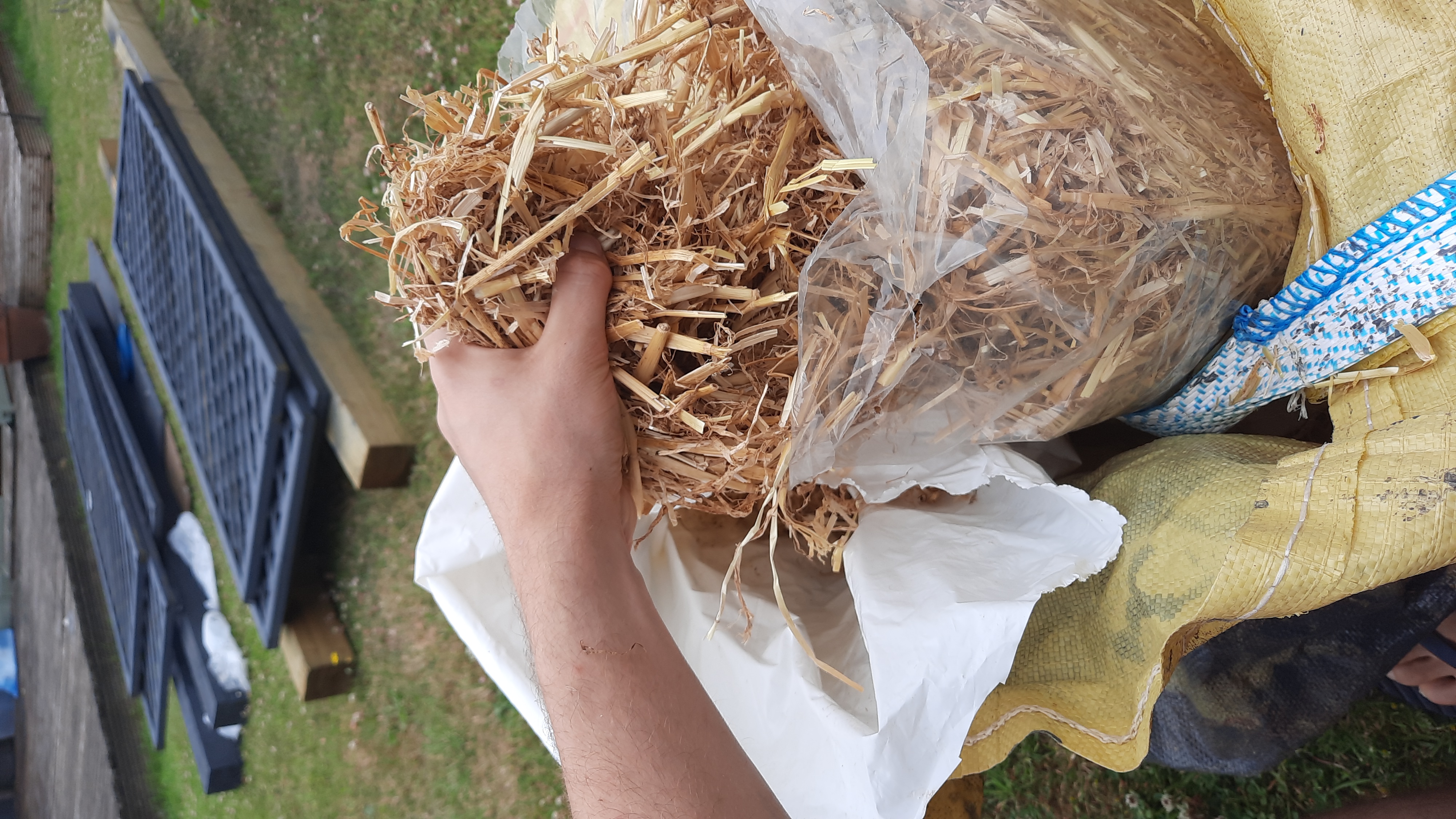Filling a bag with straw