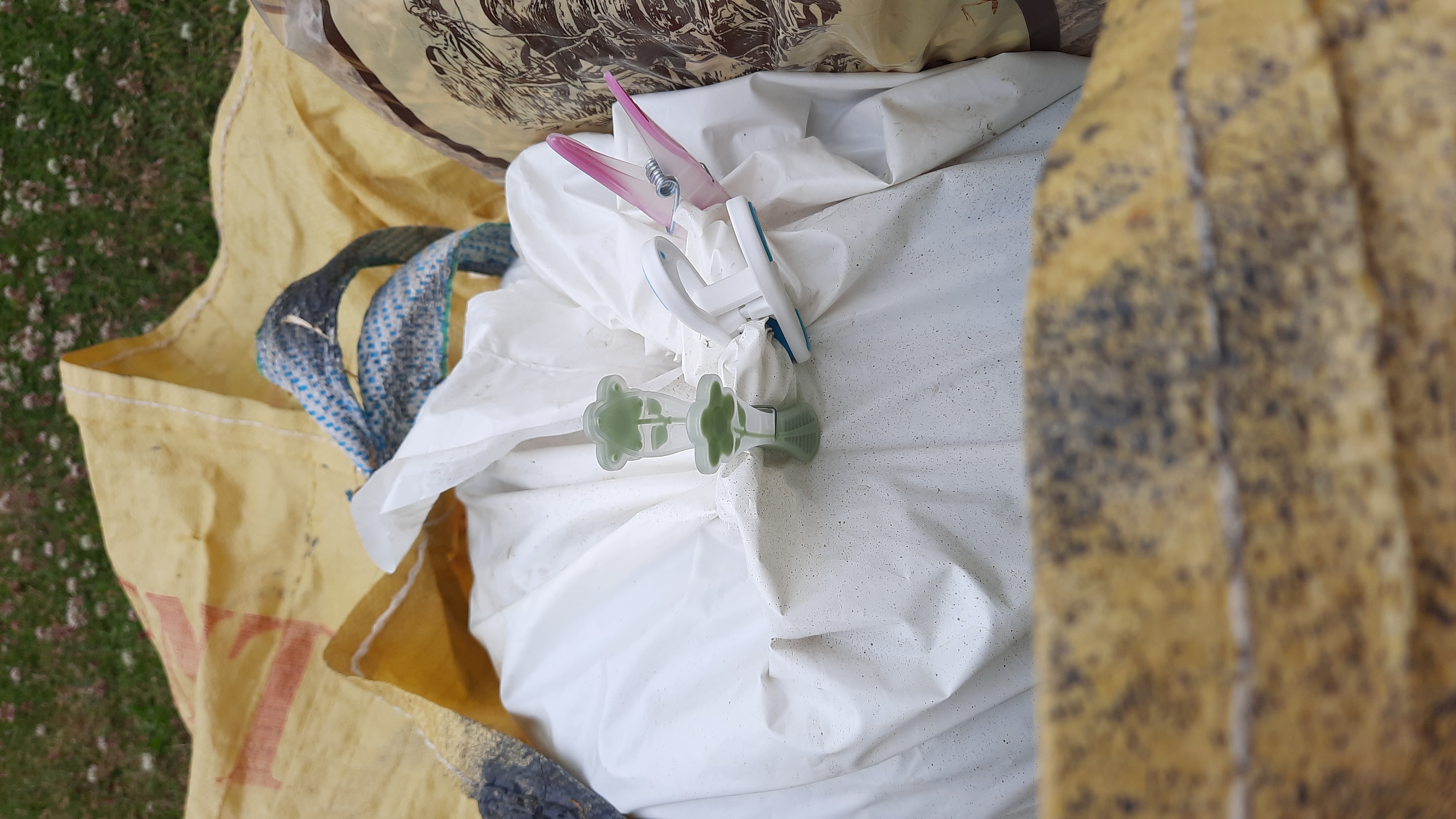 Holding the bag closed with a clothes peg