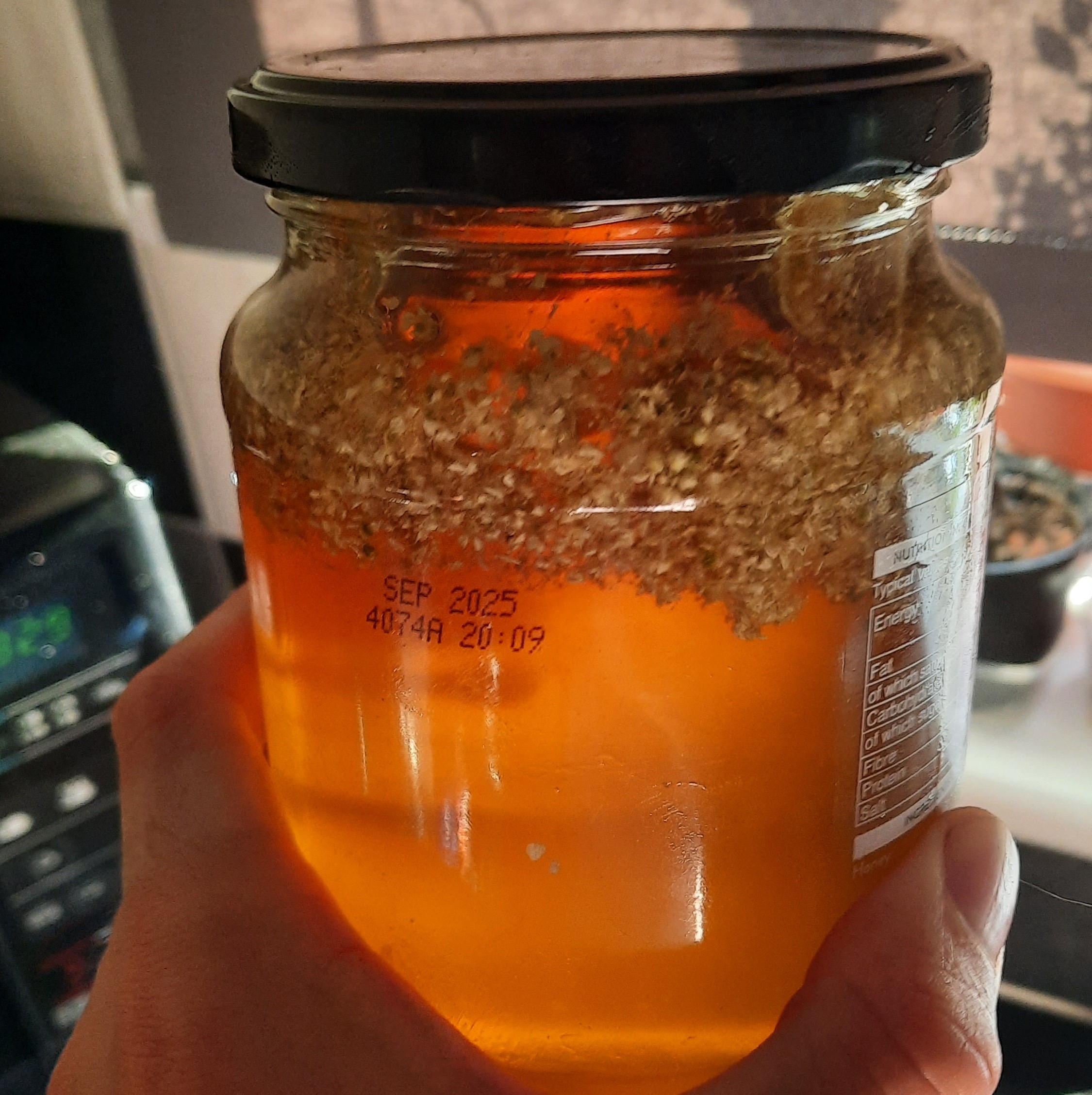 Meadowsweet flowers preserved in honey